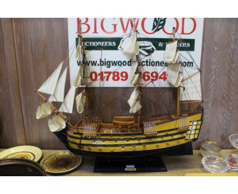 A WOODEN MODEL OF HMS VICTORY on plinth base 