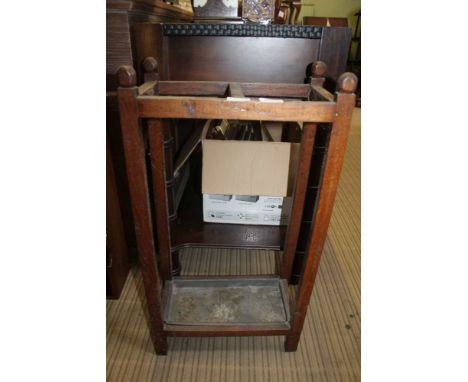 AN OAK FINISHED STICK STAND with drip tray 