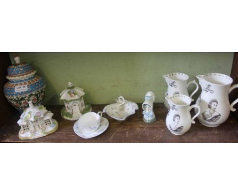 A SHELF FULL OF COLLECTABLE DOMESTIC POTTERY to include a trio of Coronation jugs, Royal Worcester Candle Snuffer &amp; two C