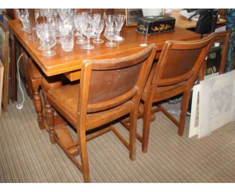 A 20TH CENTURY LIGHT OAK DINING SUITE comprising draw leaf table &amp; four chairs 