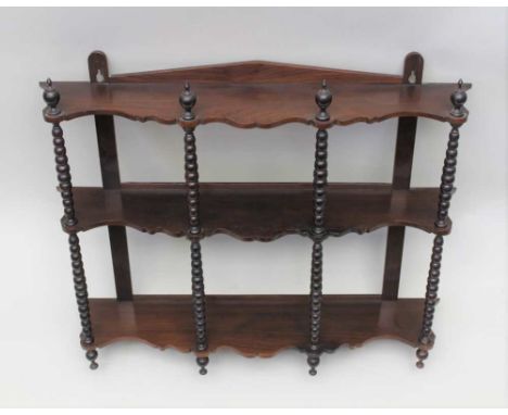 A LATE 19TH CENTURY WALL RACK, three shelves, with bobbin turned decoration, 76cm wide 