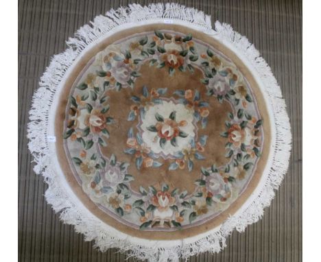 A CIRCULAR CHINESE WASHED WOOL FLOOR CARPET with floral design 