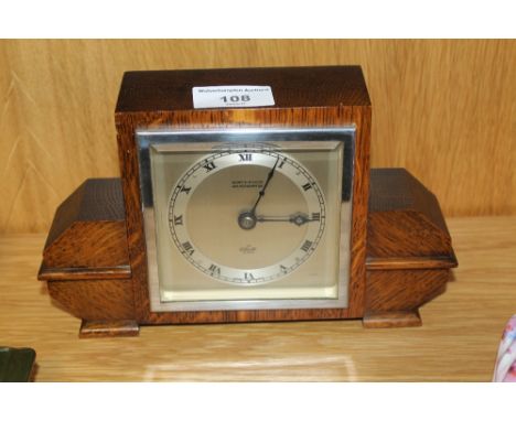 AN OAK KEMP AND WILCOX OF WOLVERHAMPTON MANTLE CLOCK 