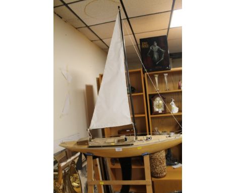 A SCRATCH BUILT MODEL OF A YACHT ON STAND 