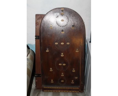 A BAGATELLE GAME WITH A WOODEN PRESS 