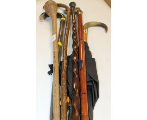 A COLLECTION OF VINTAGE WALKING STICKS, UMBRELLAS ETC, to include a parasol handle with polished stone ball finial (possibly 