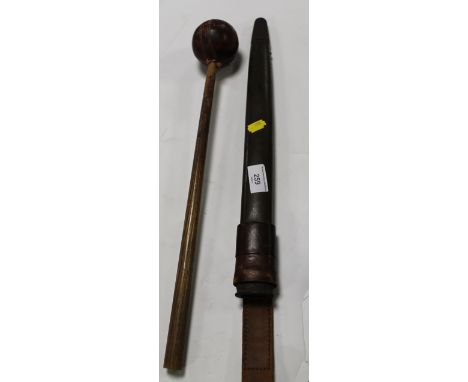 A BAYONET SCABBARD TOGETHER WITH A CRICKET BALL ON A STICK 