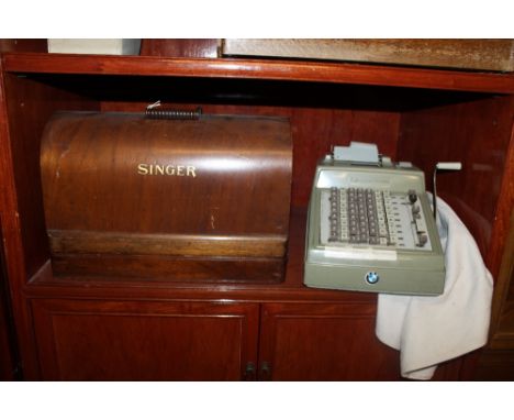 A CASED SINGER SEWING MACHINE TOGETHER WITH A VINTAGE TILL 