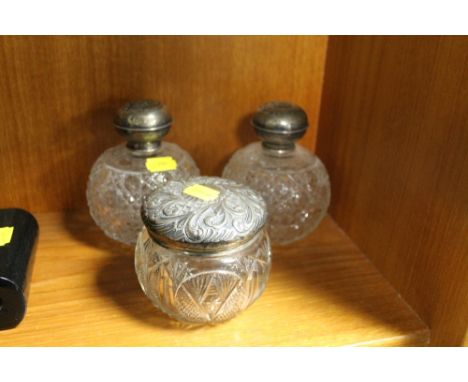 A NEAR PAIR HALLMARKED SILVER AND CUT GLASS PERFUME BOTTLES, TOGETHER WITH A HALLMARKED SILVER AND CUT GLASS JAR 