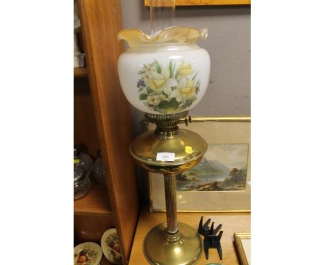 A REPRODUCTION BRASS OIL LAMP WITH DECORATED SHADE 