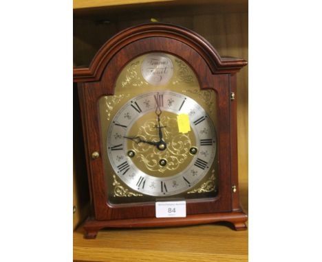 A REPRODUCTION BRACKET STYLE CLOCK 