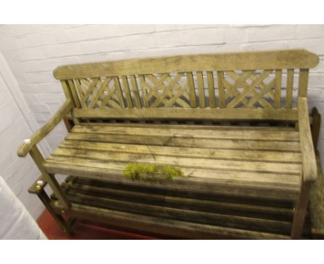 A WOODEN GARDEN BENCH