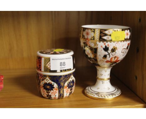 A ROYAL CROWN DERBY IMARI STYLE GOBLET TOGETHER WITH A LIGHTER AND COVER (2)