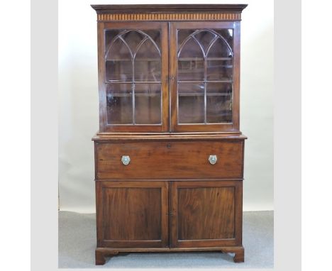 A late George III mahogany secretaire bookcase, on bracket feet, 145cm