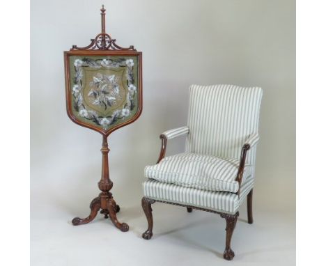 An early 20th century carved mahogany and striped upholstered Gainsborough style open armchair, on claw and ball feet, togeth