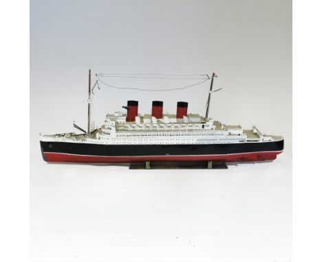 A large mid-20th century scratch built painted tin model of the liner Queen Mary, with a later fitted remote control, 155cm l