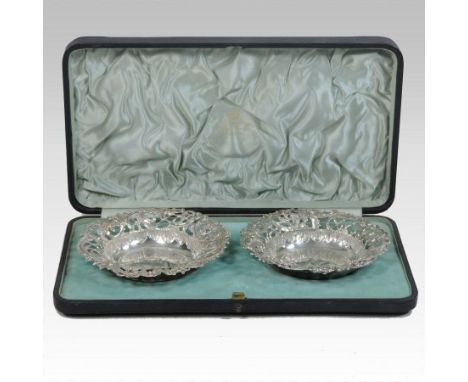 A pair of Victorian pierced silver bon bon dishes, decorated with scrolls and flowers, Birmingham 1893, 11cm diameter, retail