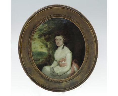 English School, 18th century, portrait of a lady seated in a landscape, oval, 36 x 30cm