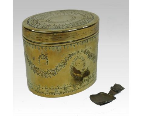 A brass tea caddy, of Adam style, of oval shape, with a removable cover, engraved with festoons, 11cm high, together with a c