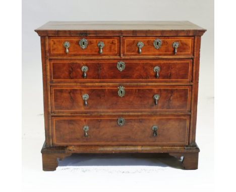A George I walnut and cross banded chest, containing two short, over three long graduated drawers, on bracket feet, 87cm 