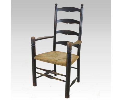 A Regency 20th century oak and rush seated Cotswold style ladder back open armchair, on turned legs