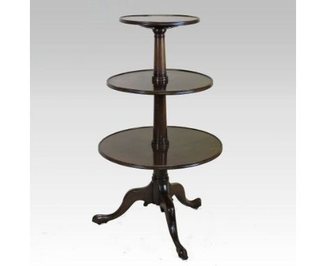 A George III mahogany three tier dumb waiter, each graduated tier united by a turned column, on a tripod base, 107cm high