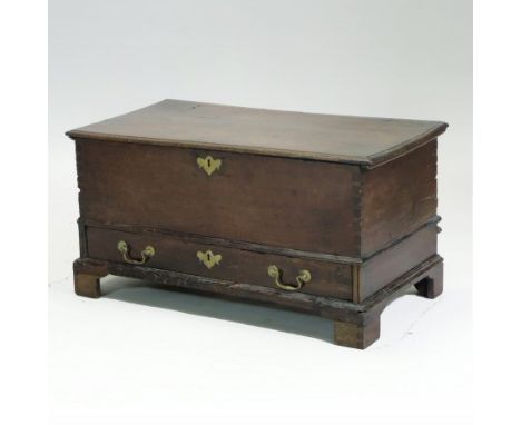 An 18th century oak mule chest, of small proportions, with a hinged lid and drawer below, on bracket feet, 87cm