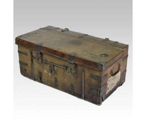 An 18th century iron bound leather travelling trunk, of small proportions, having a hinged lid and fabric lined interior, 69c