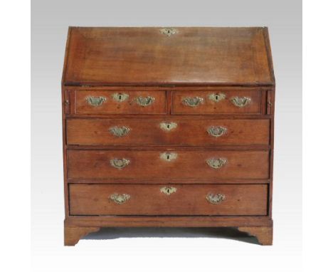 A George III oak bureau, having a hinged sloping fall, with drawers below, on bracket feet, 103cm