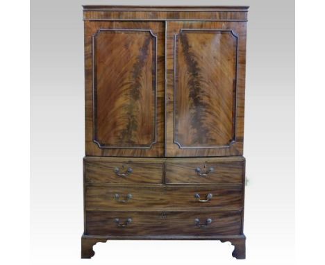 A 19th century mahogany linen press, containing a hanging rail, above an arrangement of drawers, on bracket feet, 130cm 