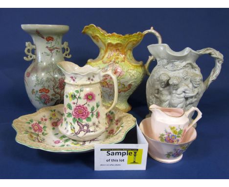 A collection of late 19th century and later ceramics including a smear glazed relief moulded jug with bacchanalian figures 25