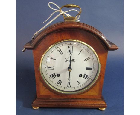 Boxwood inlaid mahogany Comitti of London twin train mantle/miniature bracket clock, the convex enamel twin train dial, strik