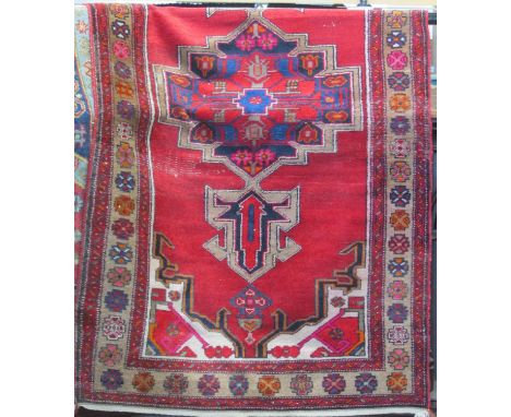 Persian runner with central medallion upon a red ground, 210 x 120 cm 