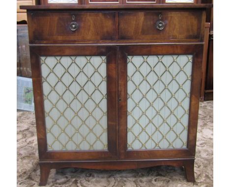 A small good quality reproduction Regency style side cabinet fitted with two frieze drawers over a cupboard enclosed by a pai