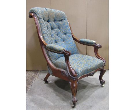 A Victorian rosewood drawing room chair with floral patterned serpentine shaped upholstered seat, scrolled button back and ar