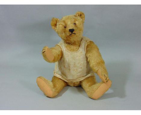 Early 20th century teddy bear by Steiff with pin in ear, light brown fur, pronounced snout, stitched nose, mouth and claws, h