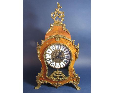 Inlaid Kingwood boulle type clock, inlaid with scrolled foliage with rococo gilt metal mounts, the gilt dial with inset ename