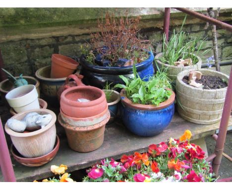 A quantity of garden pots and planters to include a pair of reclaimed examples in the form of coopered half barrels, blue gla