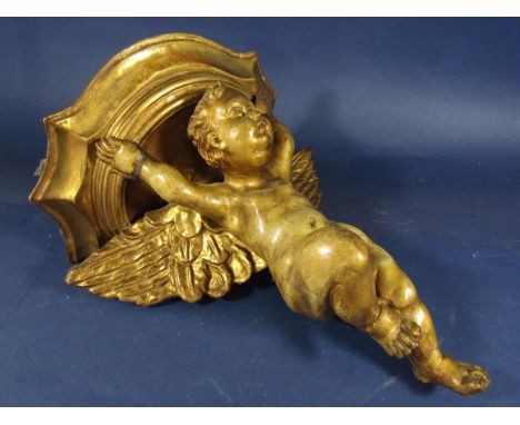Carved gilt wood and gesso bracket in the form of a winged cherub, 32cm high 