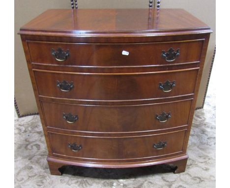 A reproduction Georgian style mahogany veneered bow fronted chest of four long graduated drawers raised on bracket supports, 