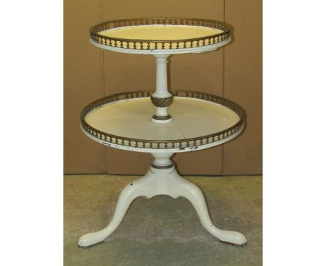 An antique Georgian style dumb waiter on two circular graduated galleried tiers, raised on a central turned pillar and swept 