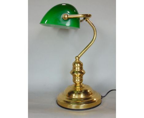 A brass bankers lamp with green glass shade 