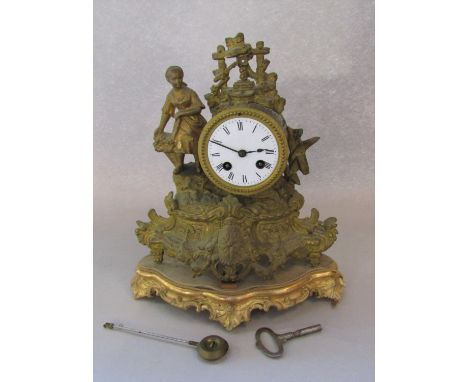 French gilt spelter figural drumhead mantel clock, the twin train enamel dial with roman numerals flanked by a flower girl, o