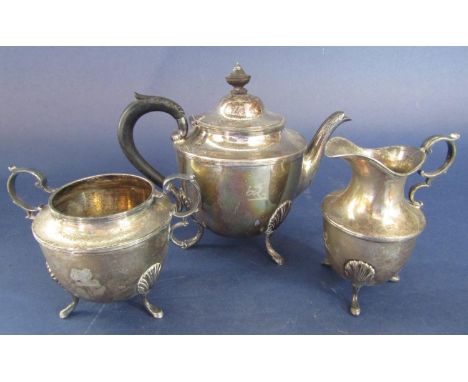 Late Victorian silver three piece bullet bachelor tea service comprising tea pot with acanthus handle, milk jug and sucrier a