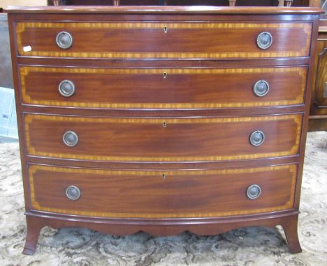 A good quality reproduction Georgian style mahogany bow fronted bedroom chest of four long graduated drawers with satinwood c