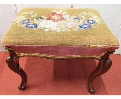 A mid-19th century rosewood centre stool, raised on four cabriole supports, with hand worked floral tapestry top 