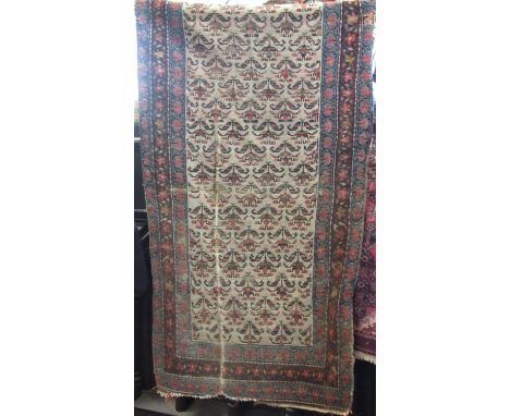 Eastern runner with geometric floral decoration upon a cream ground, 240 x 170 cm ` 