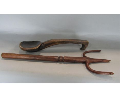 Early primitive carved folk art spoon or ladle, 32cm long together with a further similar fork, 35cm long (2) 