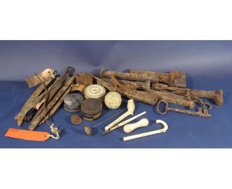 A mixed collection of antique finds to include early iron hand tools and other finds to include clay pipe, ivory parasol hand