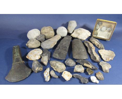 A collection of early hand tools to include pieces of flint, rock and stone 